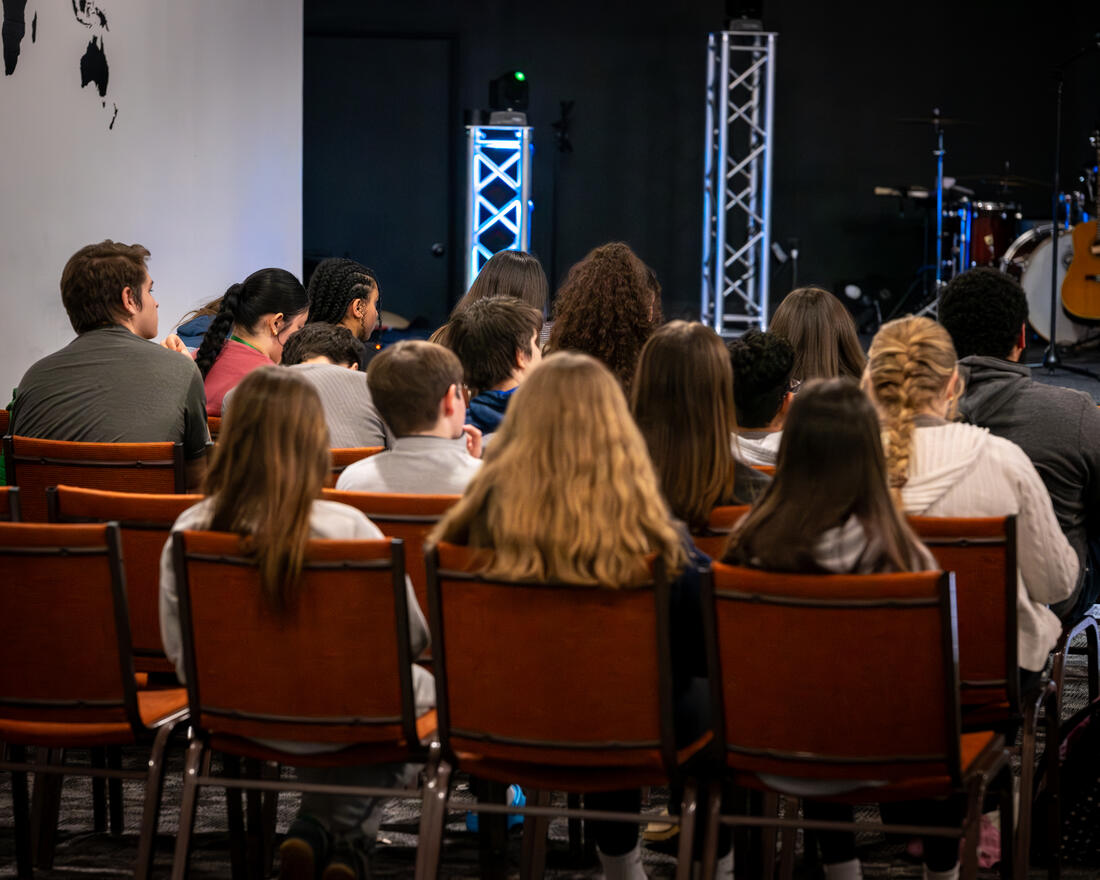 A room of students facing the stage